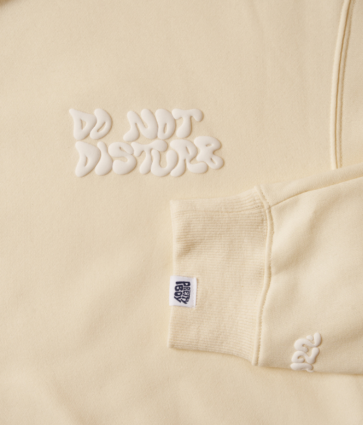 Do not disturb design hoodie closeup - cream colored